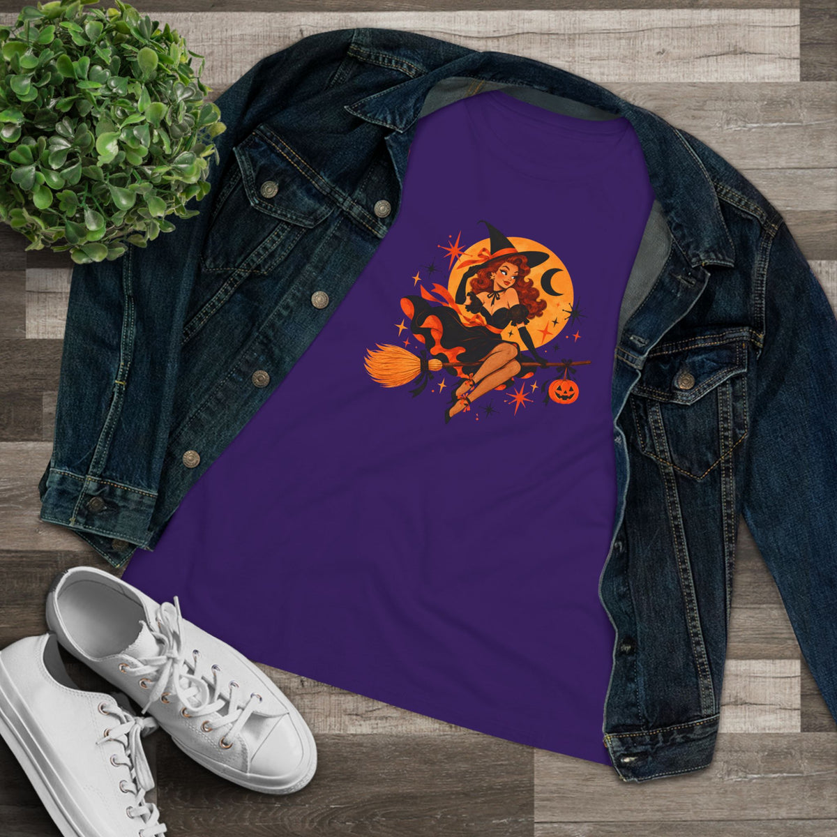 Purple flying witch shirt styled with denim jacket and sneakers