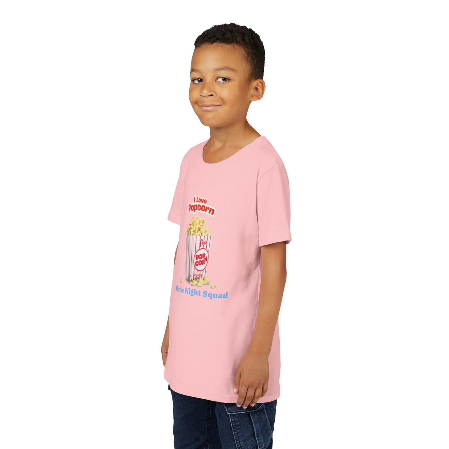 Young boy wearing pink T-shirt with popcorn graphic and 'Movie Night Squad' text