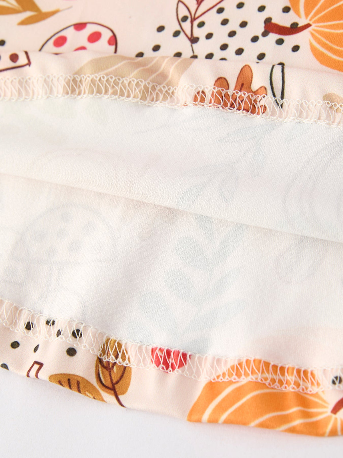 Girls Fall Dress | Pumpkin & Leaf Print: Inside skirt hem and stitching