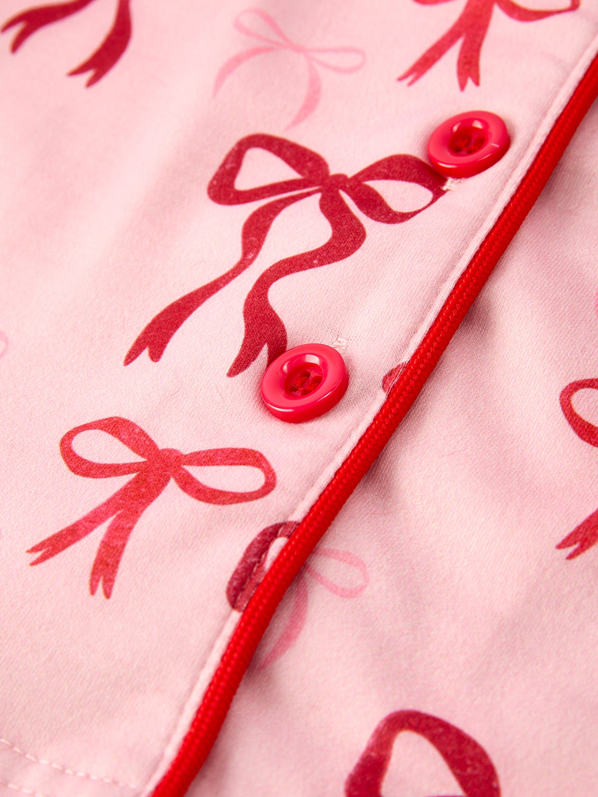 Girls Christmas Pajamas | Pink Bow Furry Trim: Red button and bow print