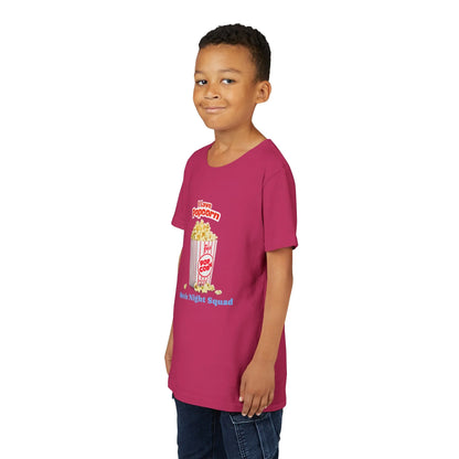 smiling boy wearing magenta t-shirt with popcorn bucket graphic and movie night squad text