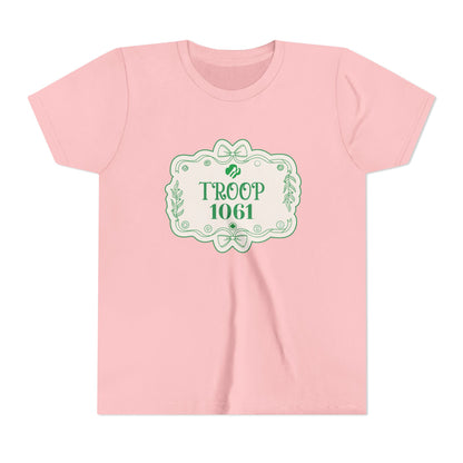 Pink t-shirt with green graphic and text 'Troop 1061' on a white background