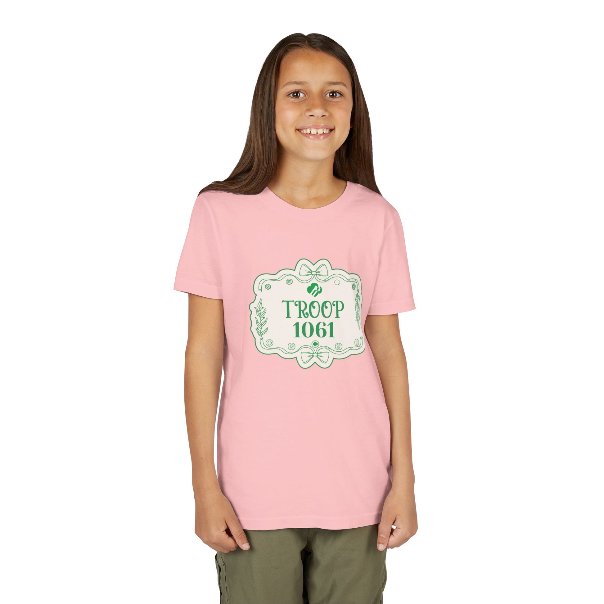 Girl wearing a pink t-shirt with 'Troop 1061' design on a white background