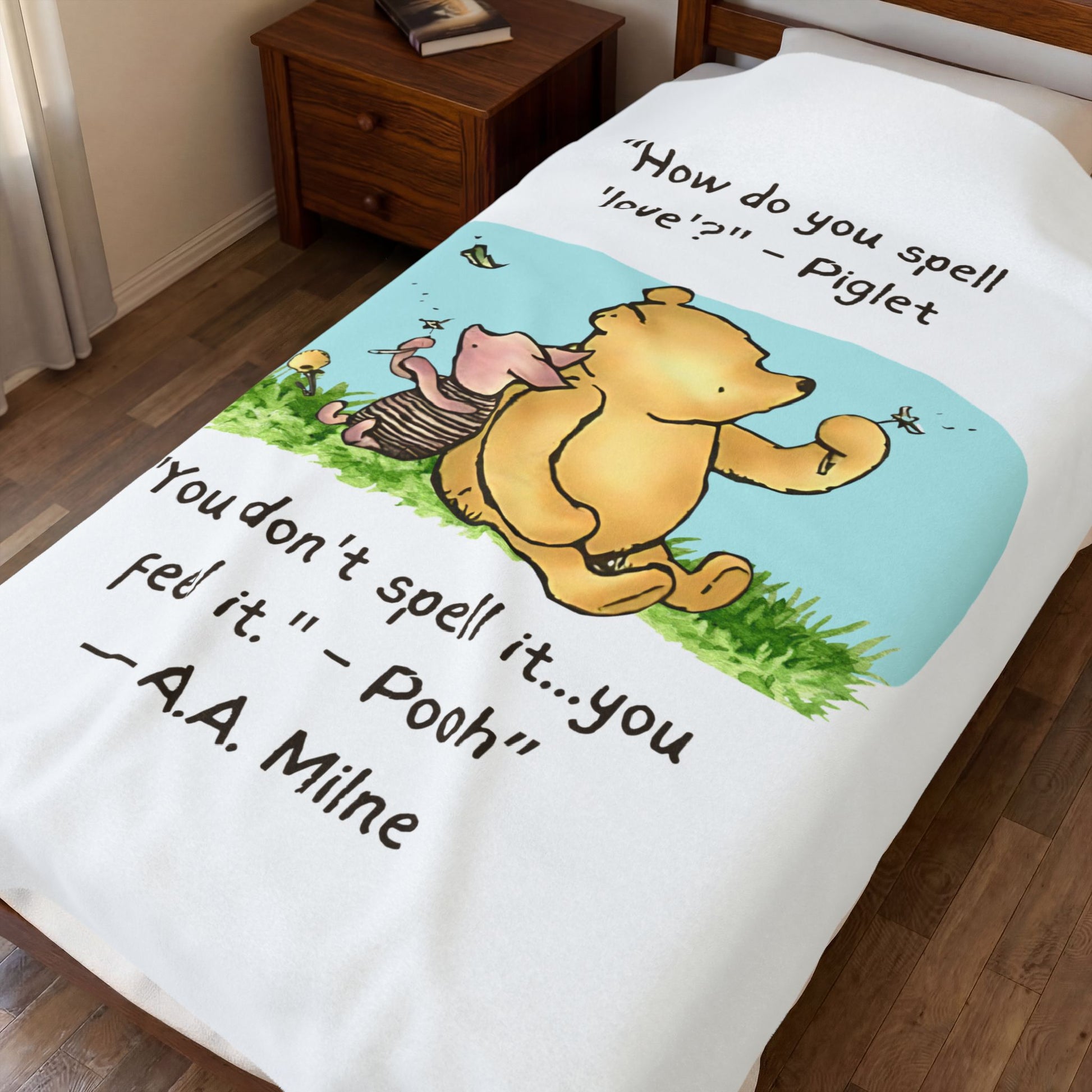 60" x 80" Blanket with Winnie the Pooh and Piglet cartoon and text on a twin bed. blanket covers the bed and slightly hangs from sides of bed.
