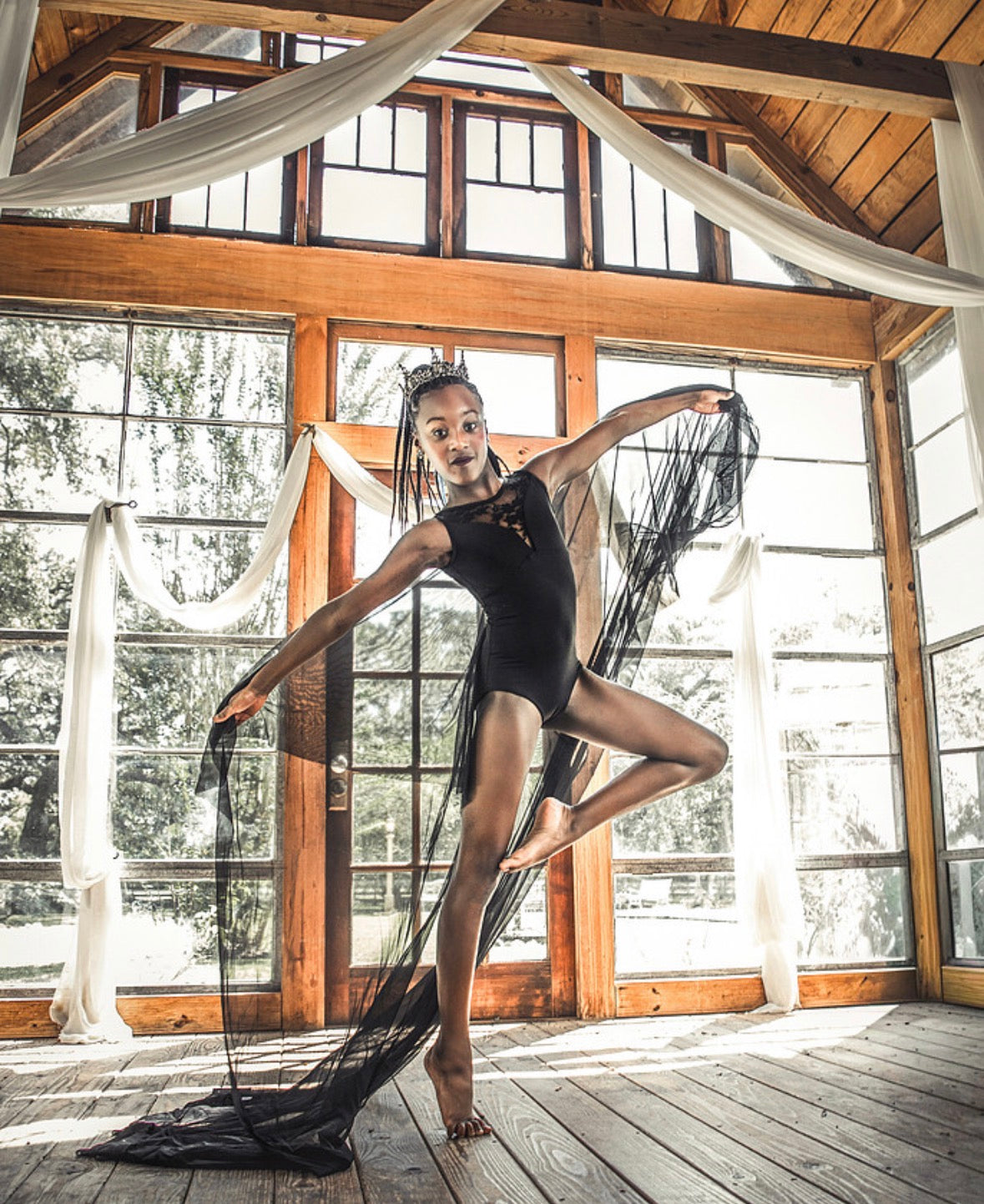 Black Lace Leotard | Black Swan: Dancer posing with arms extended