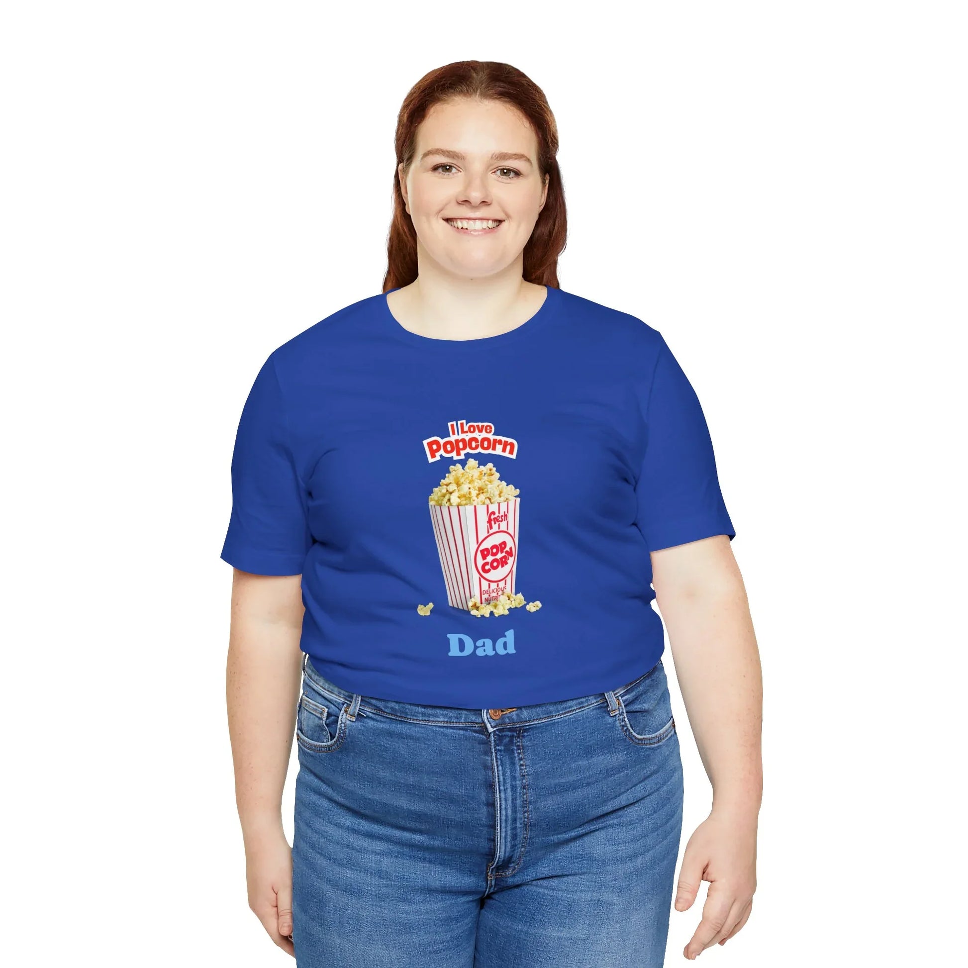 Smiling woman wearing blue T-shirt with popcorn graphic and text I Love Popcorn Dad