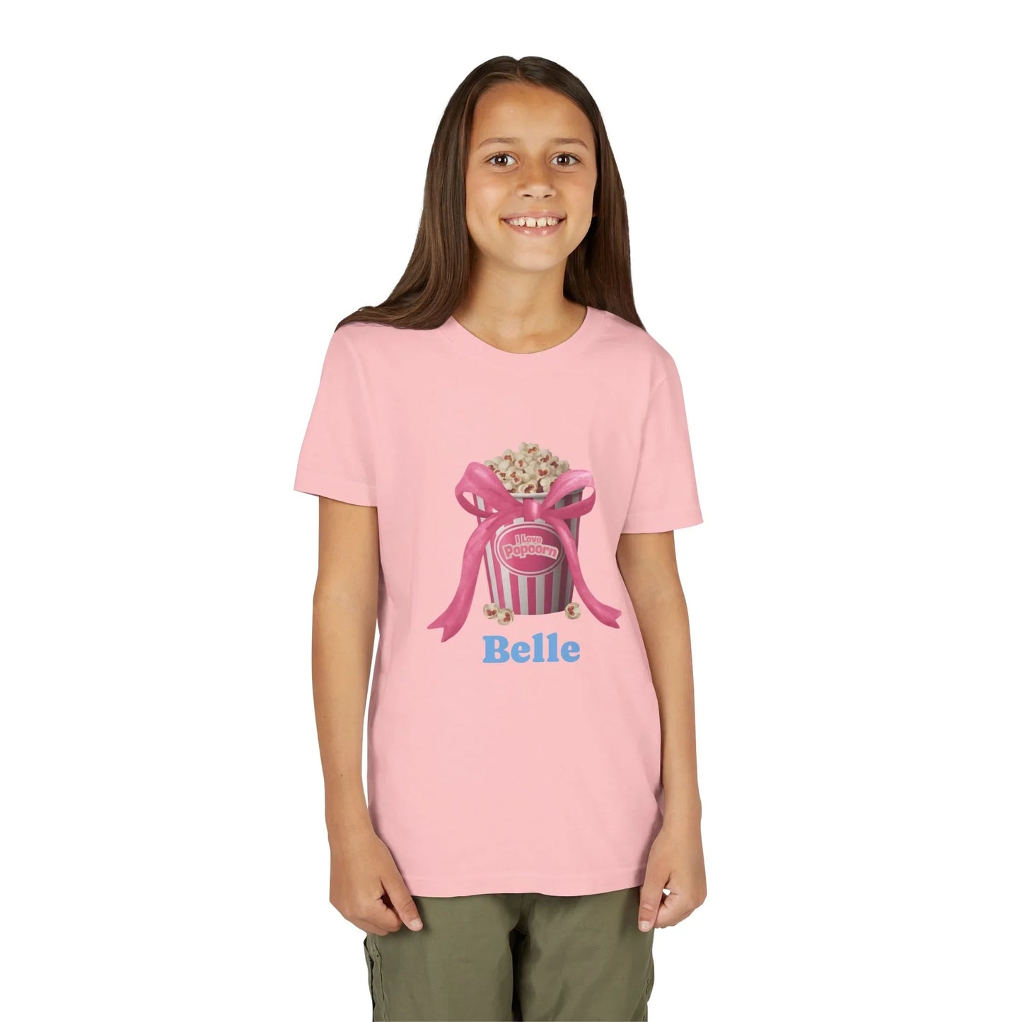 Smiling girl wearing pink T-shirt with popcorn bucket and Belle text graphic
