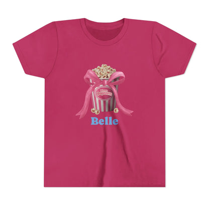 Magenta T-shirt with popcorn bucket graphic tied with pink bow and text 'I love Popcorn' and 'Belle'