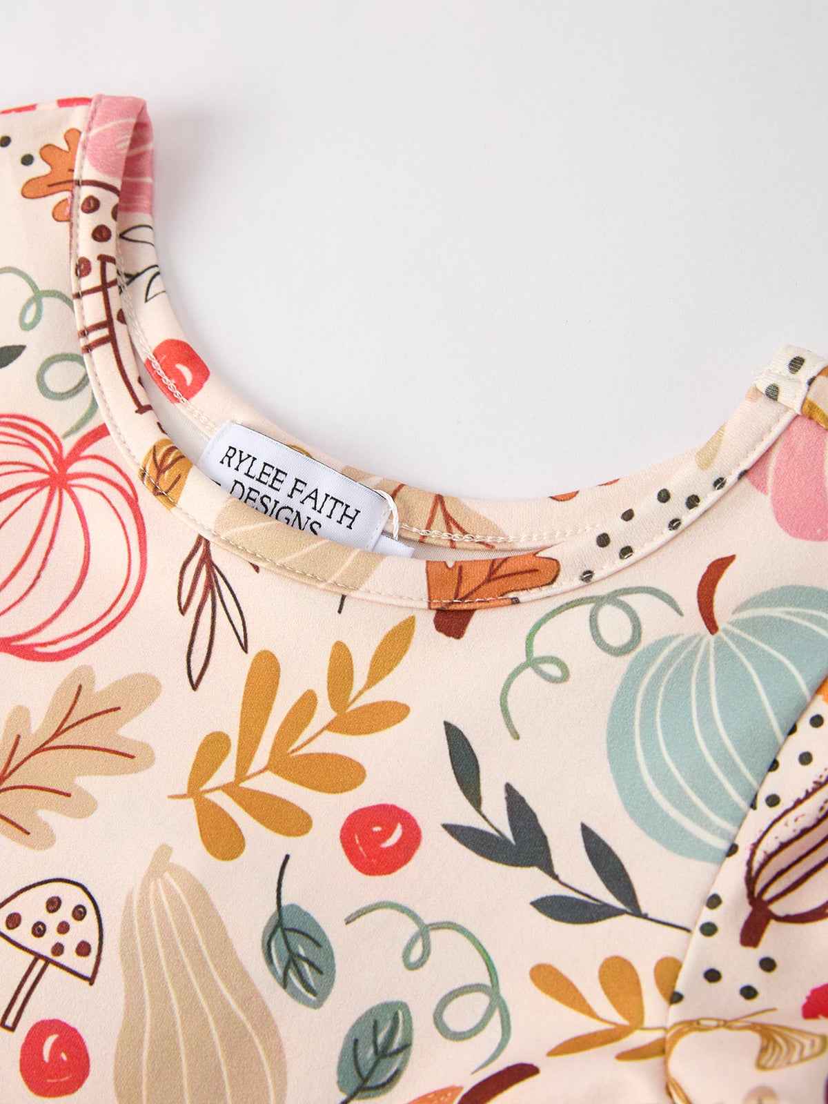 Girls Fall Dress | Pumpkin & Leaf Print: Neckline and label detail