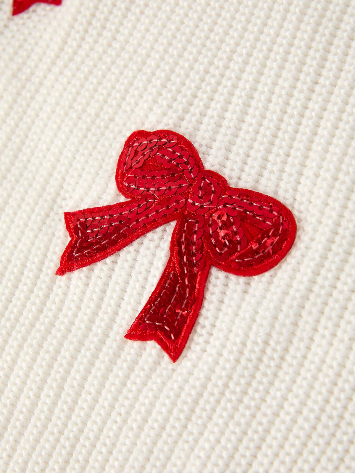 Mommy and Me Sweaters | Red Sequin Bows: Red sequin bow close-up