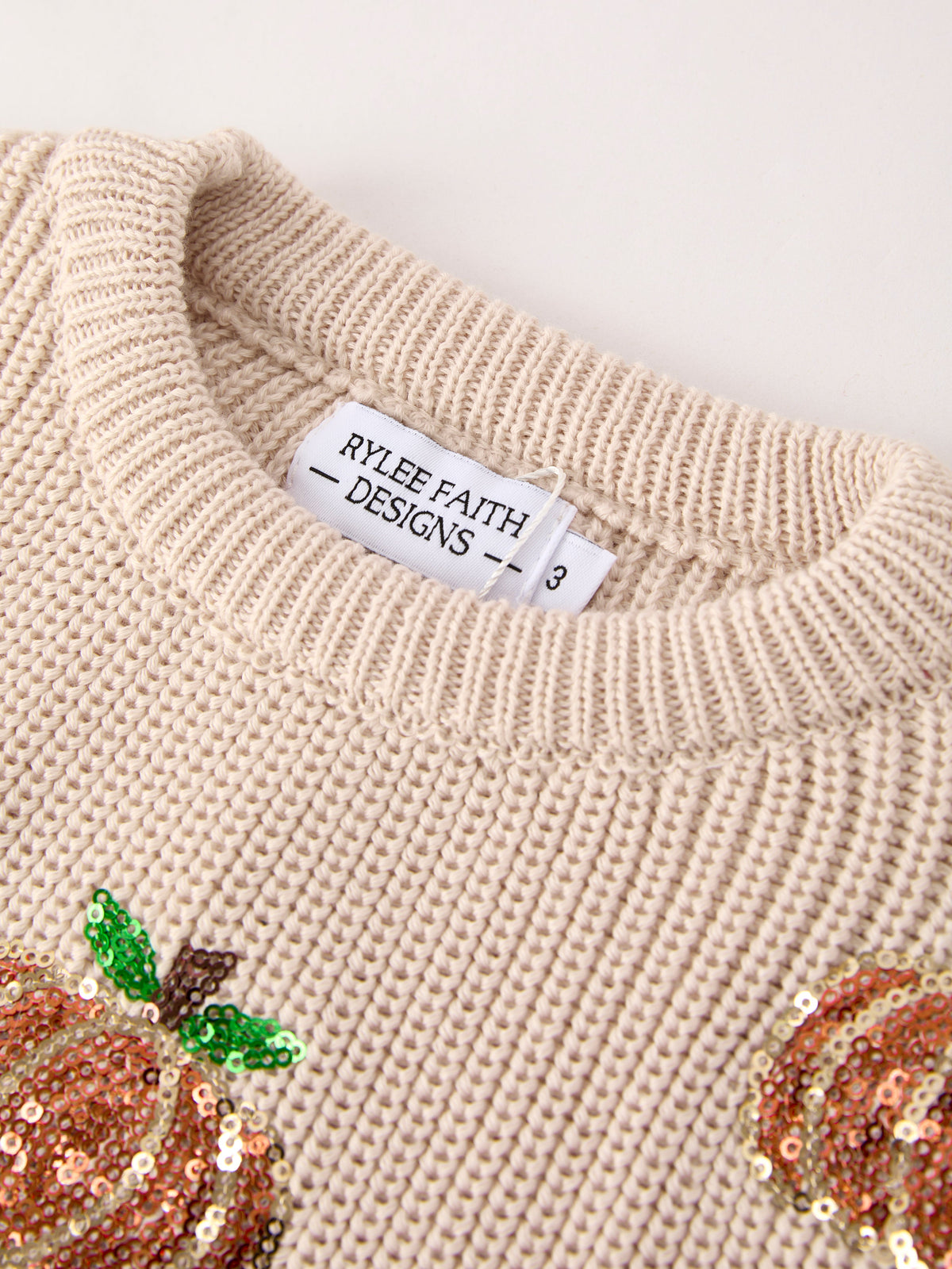Girls Fall Sweater | Beige Sequin Pumpkins: Ribbed neckline and label