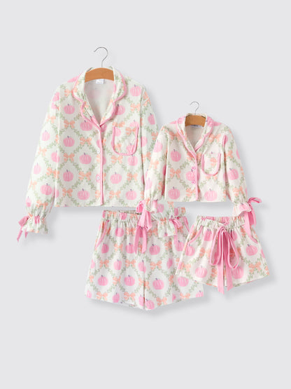 Mommy and Me Pajamas | Pumpkin Floral Shorts: Adult and child matching sets on hangers