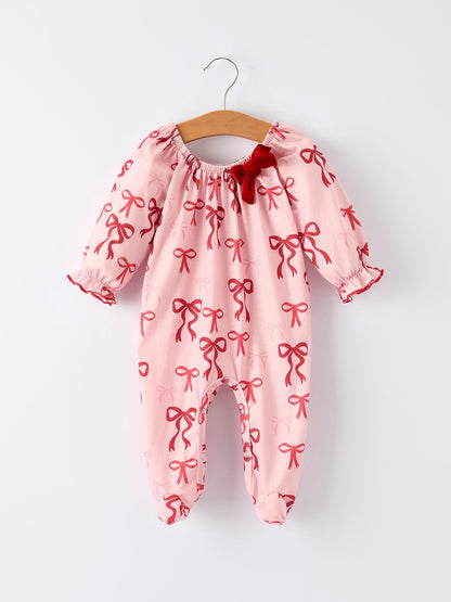 Baby Girl Romper | Pink Christmas Bow Print: Front on hanger
