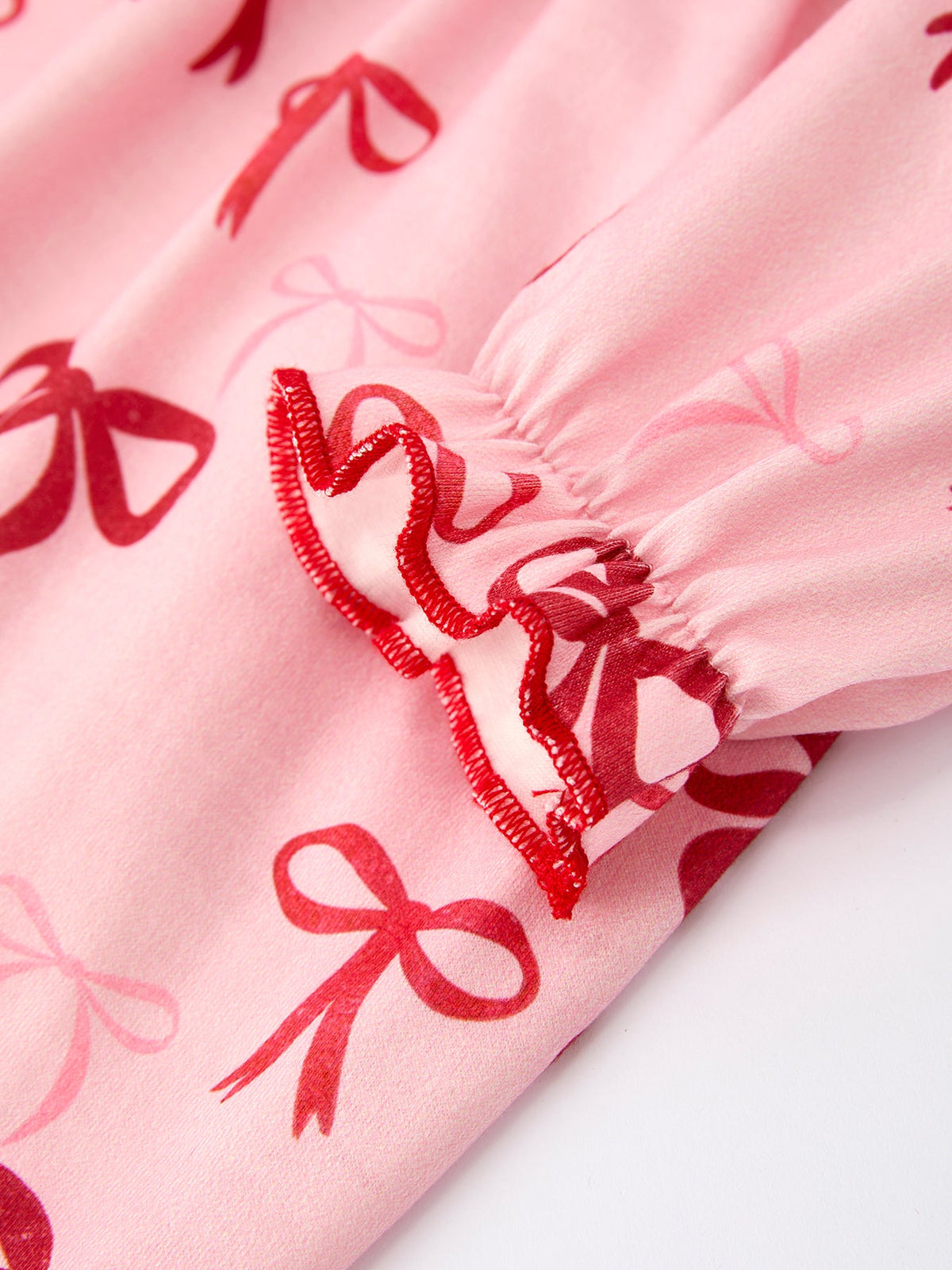 Baby Girl Romper | Pink Christmas Bow Print: Long sleeve bow print detail