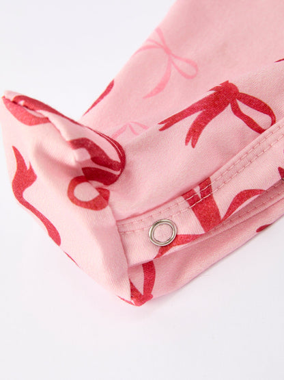 Baby Girl Romper | Pink Christmas Bow Print: Lower snap opening detail