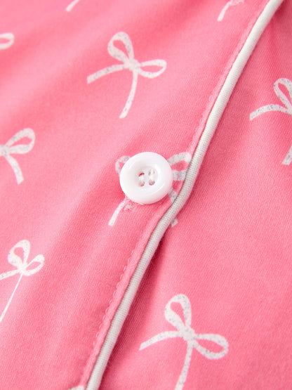 Mommy and Me Pajamas | Pink Bow Ruffle Shorts: White button and bow print close-up