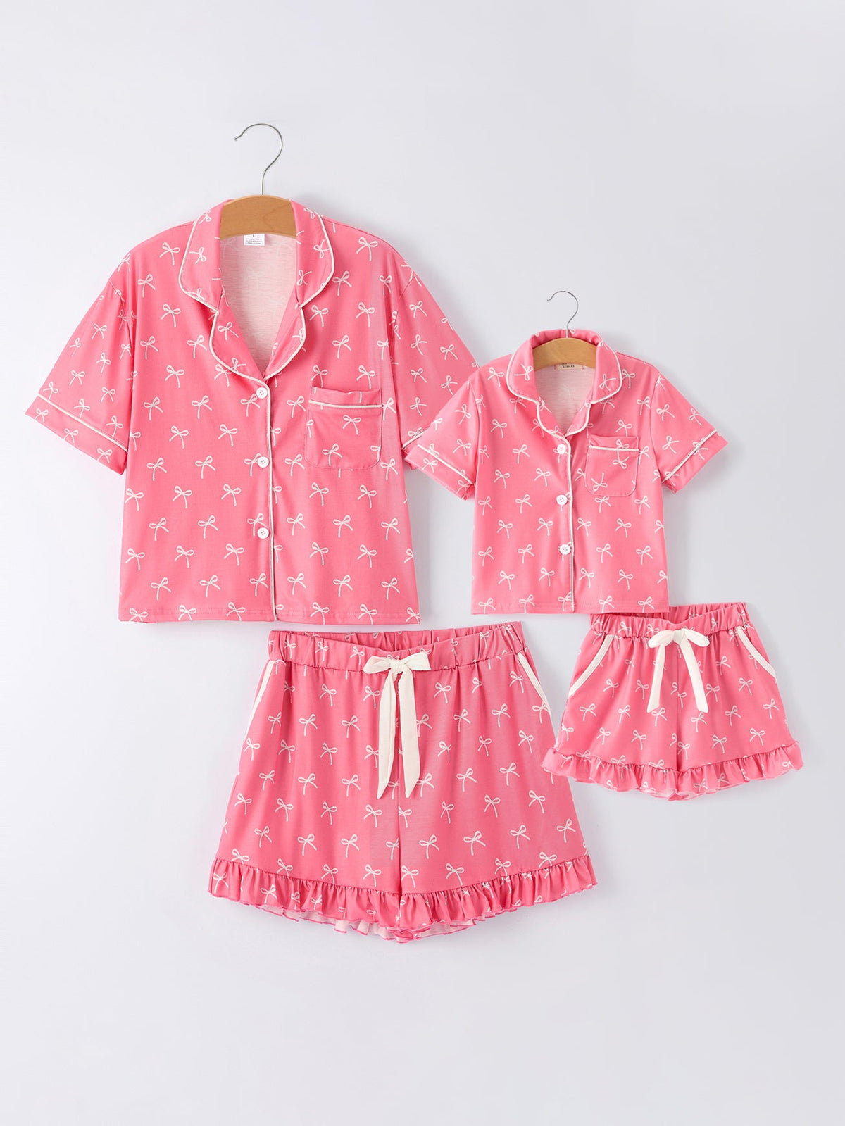 Mommy and Me Pajamas | Pink Bow Ruffle Shorts: Matching adult and child sets on hangers