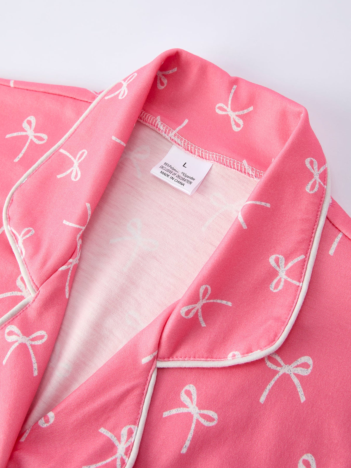 Mommy and Me Pajamas | Pink Bow Ruffle Shorts: Child collar and brand label