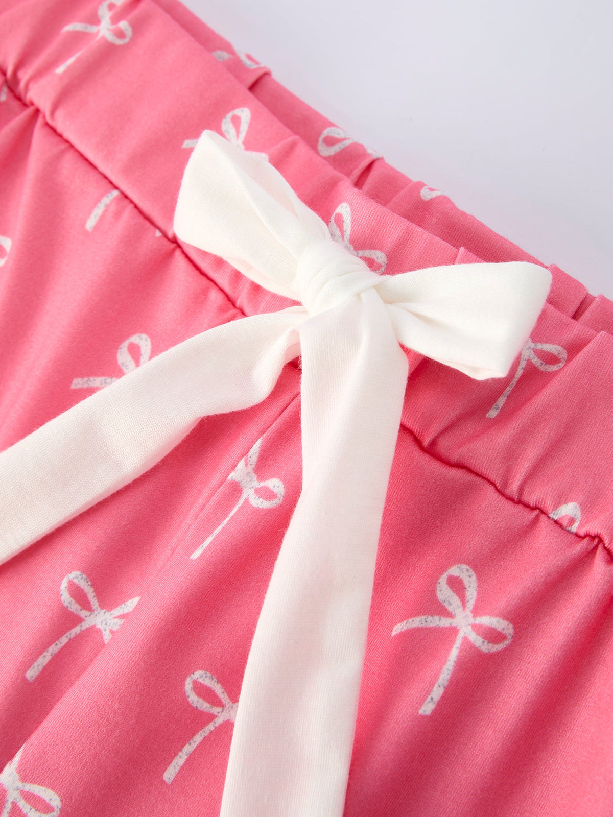 Mommy and Me Pajamas | Pink Bow Ruffle Shorts: White waist bow close-up