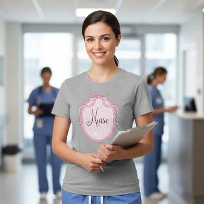 Woman in a hospital setting wearing a 'Nurse' t-shirt with a pink design.