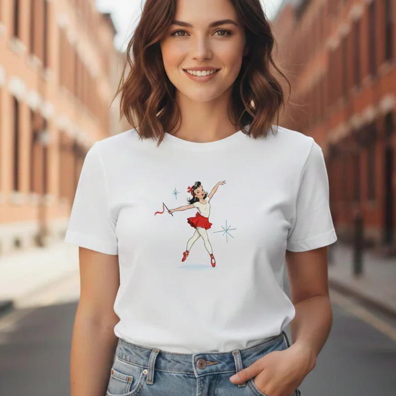 Woman wearing a white t-shirt with a graphic design on a city street.