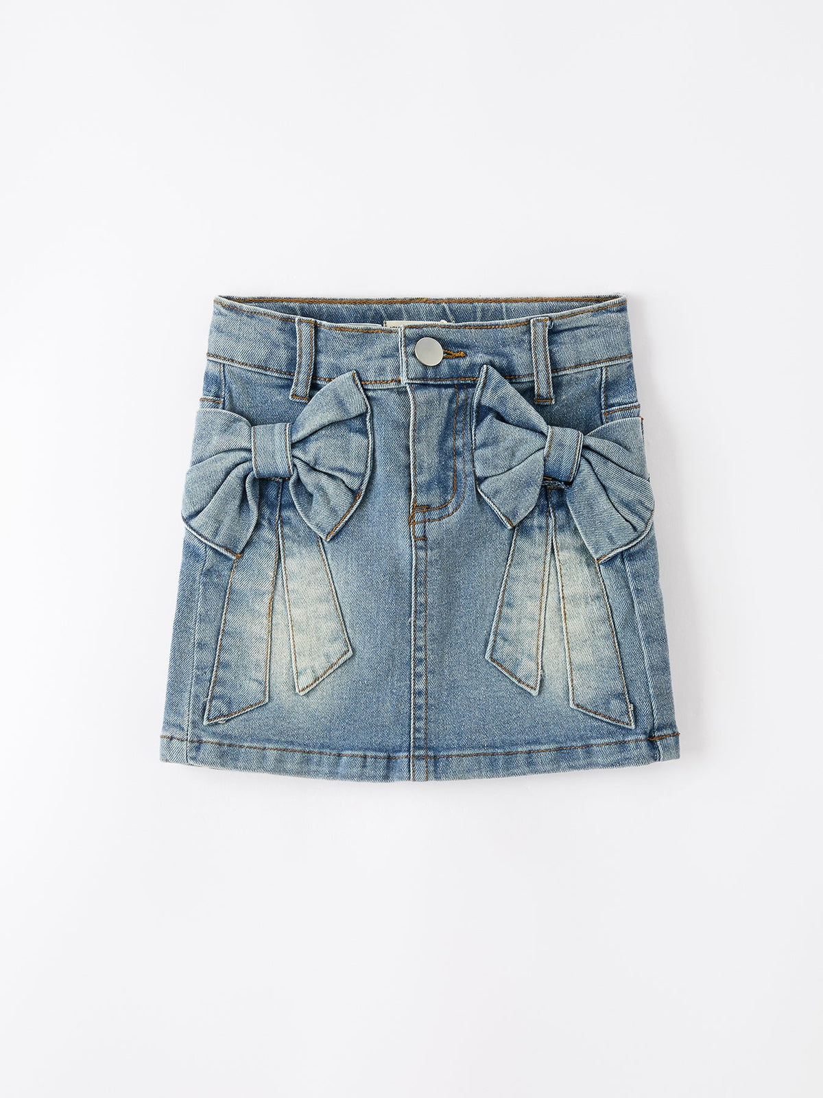 Blue denim skirt with bow details on a white background