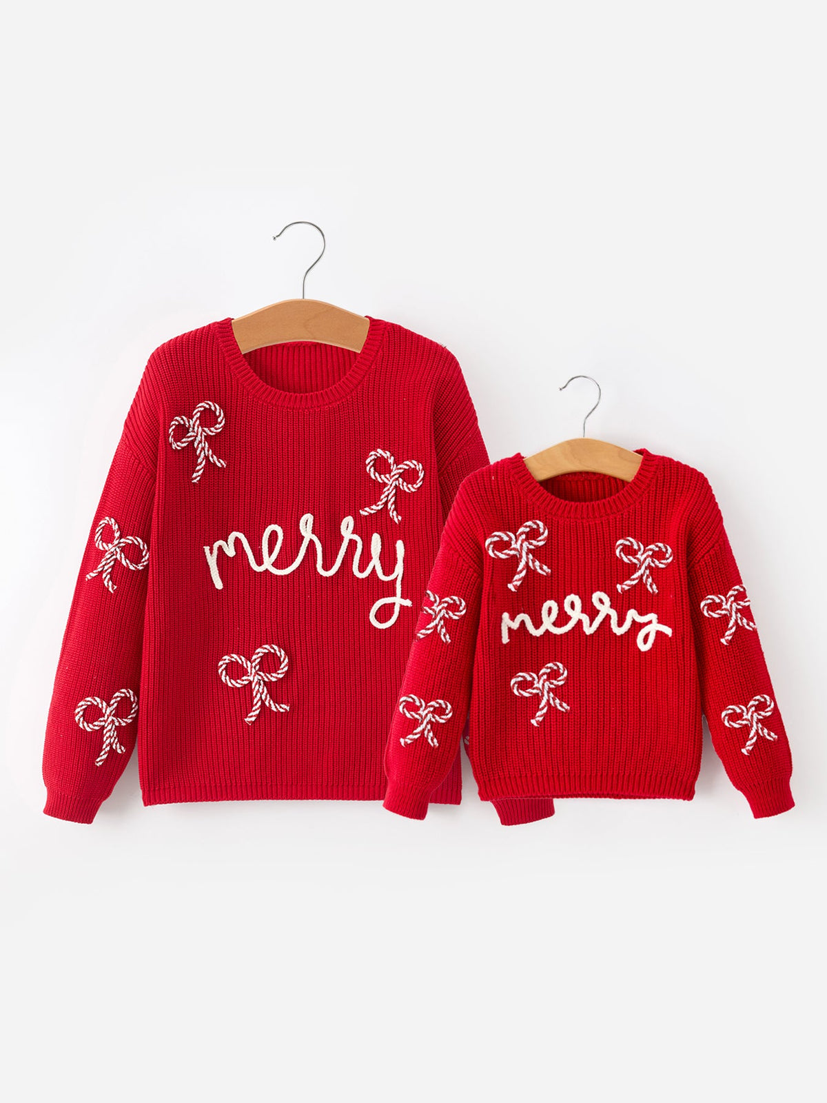 Mommy and Me Sweaters | Red Merry & Bows: Adult and child pullovers on hangers
