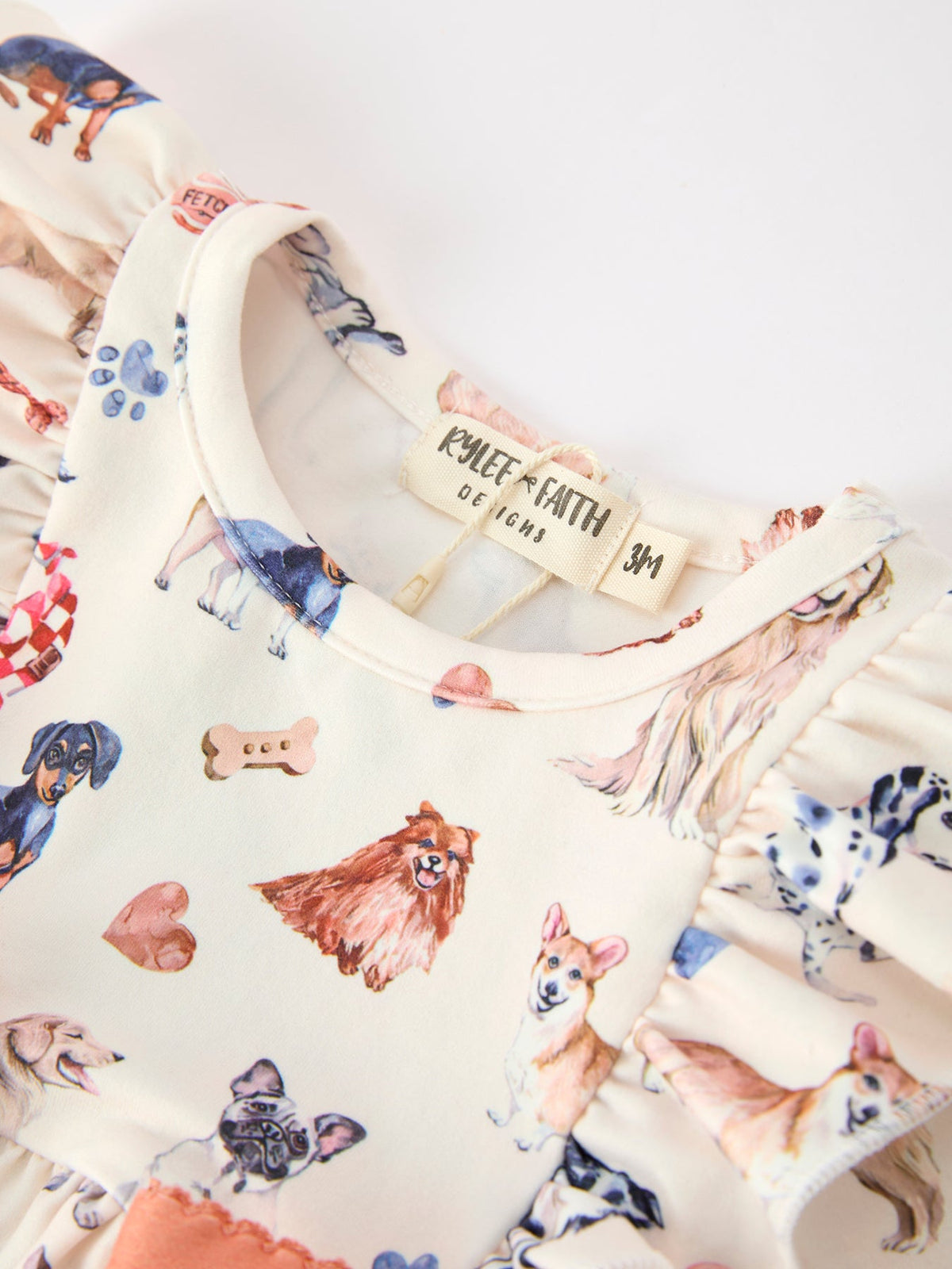 Baby Girl Romper | Fall Dogs & Ruffle Bows: Neckline and dog print detail