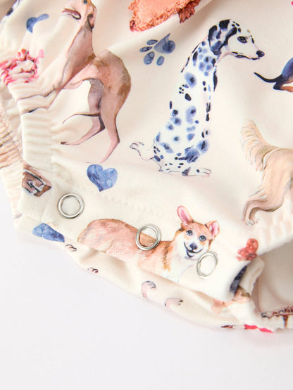 Baby Girl Romper | Fall Dogs & Ruffle Bows: Dog print and hem close-up