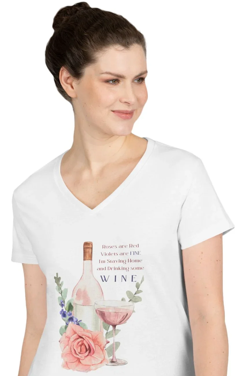 Woman wearing a white t-shirt with text "Roses Are Red, Violets are FINE, I'm Staying Home and Drinking WINE" on a white background