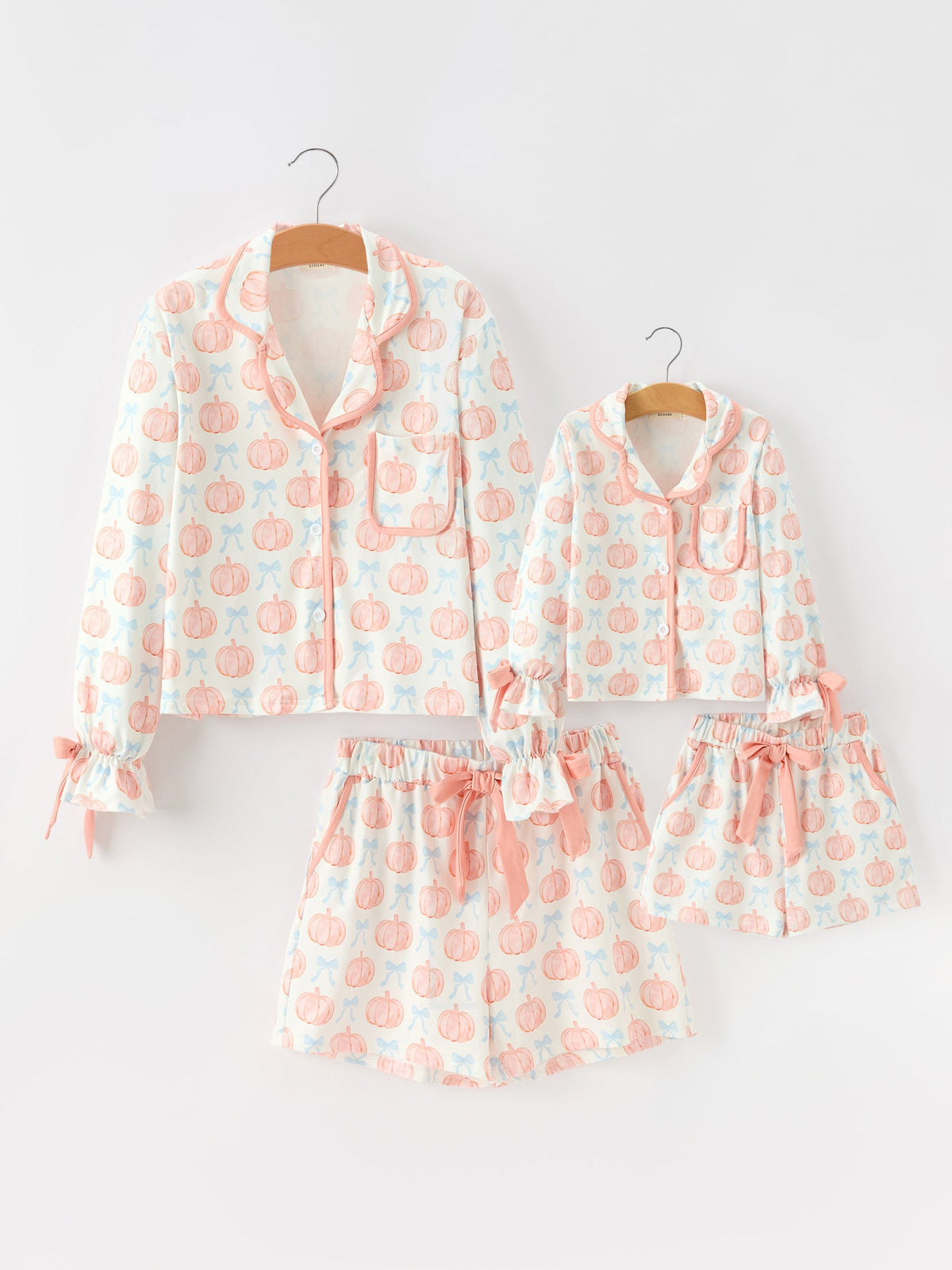Mommy and Me Pajamas | Pastel Pumpkin Shorts: Matching adult and child sets on hangers