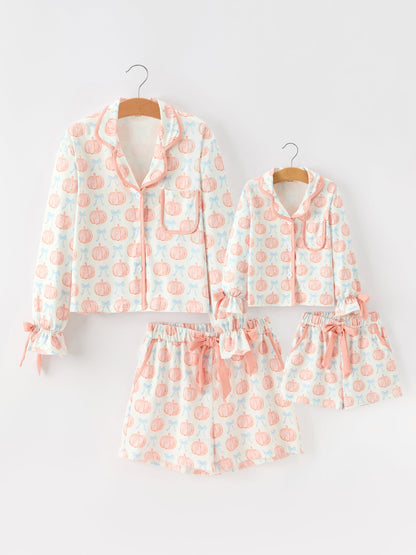 Mommy and Me Pajamas | Pastel Pumpkin Shorts: Matching adult and child sets on hangers