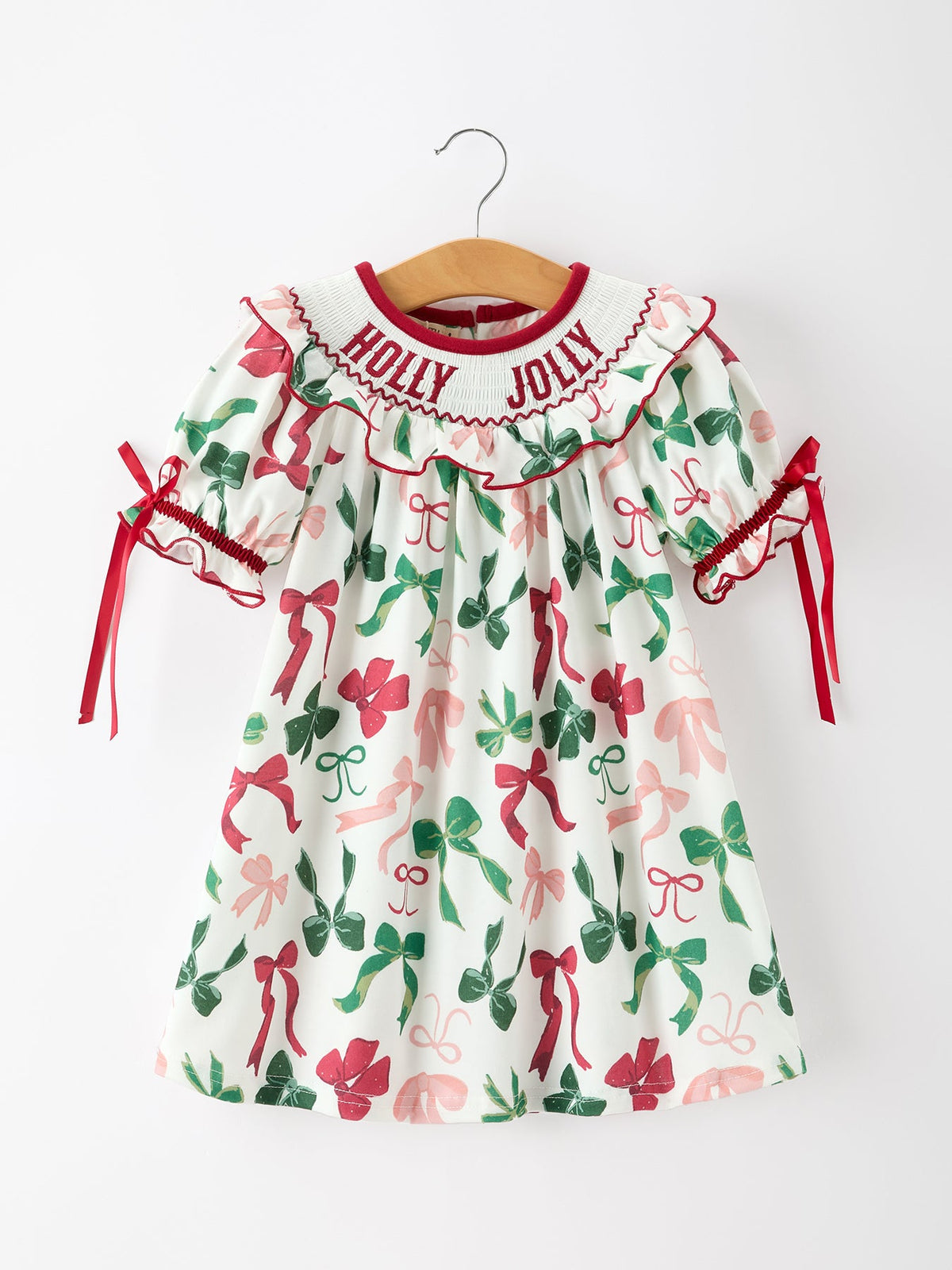 Girls Holly Jolly smocked ruffle dress with watercolor bows, featured product photograph