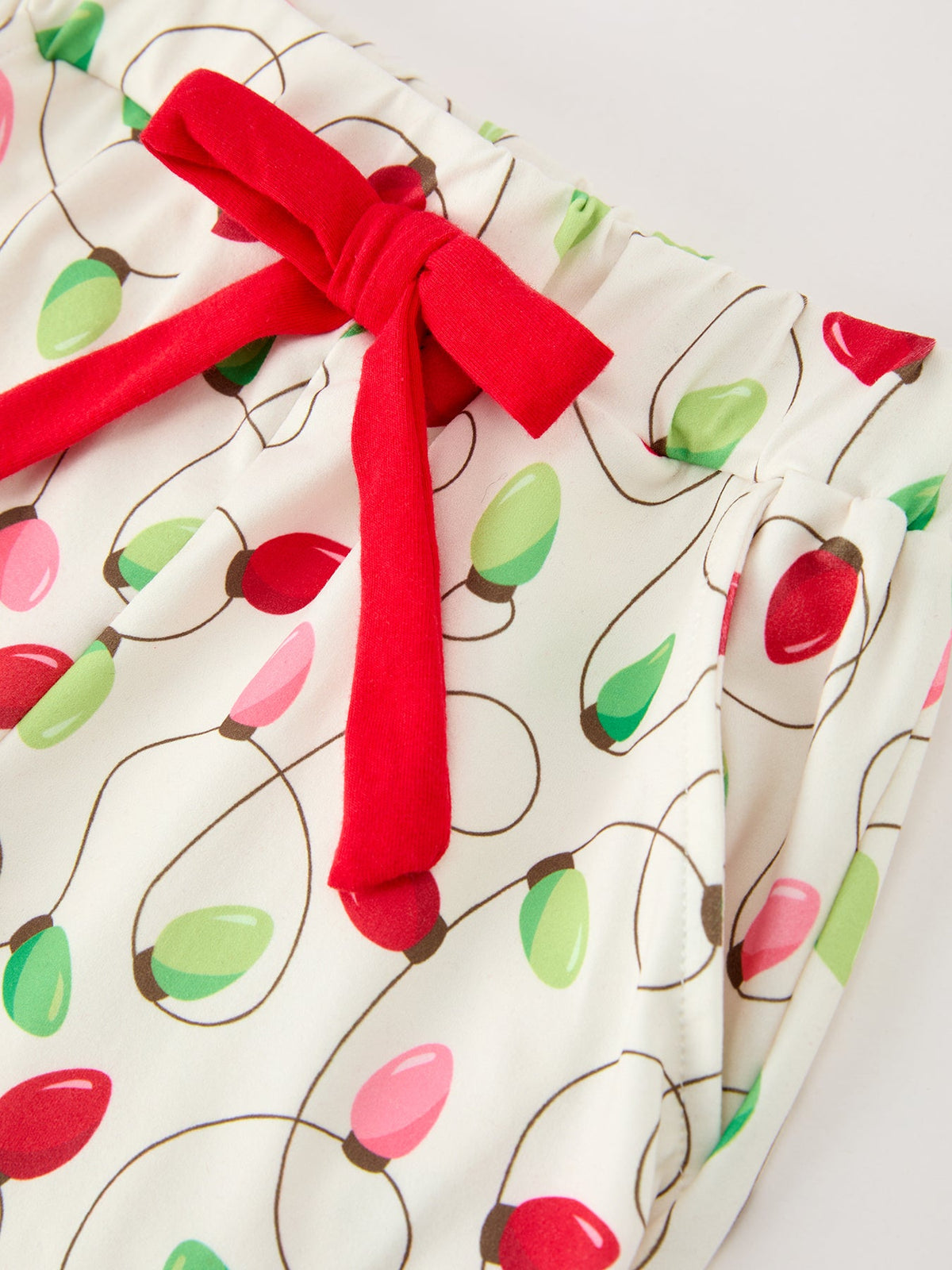 Girls Christmas Pajamas | Lights & Bow Ties: Red bow tie and waist detail