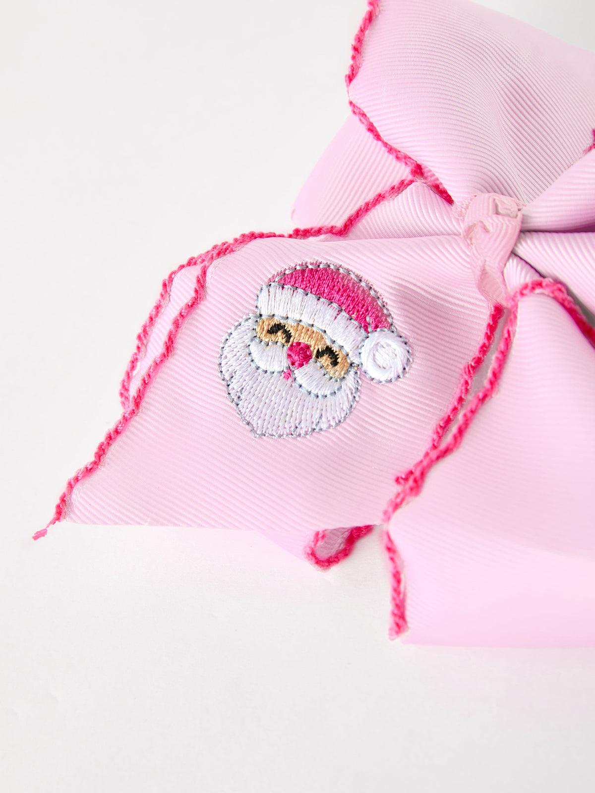 Christmas Hair Bow | Santa Embroidered 6.25 Inch: Santa embroidery on pink ribbon