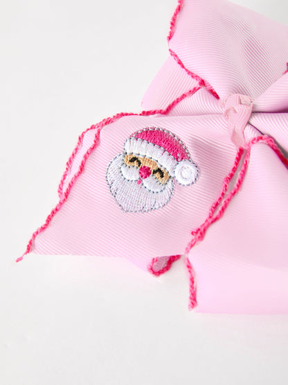 Christmas Hair Bow | Santa Embroidered 6.25 Inch: Santa embroidery on pink ribbon