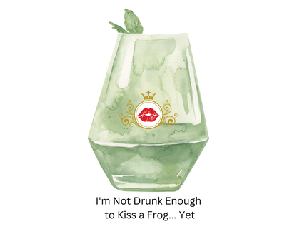 A watercolor-style illustration of a green-tinted glass with a mint leaf on top and a red lips graphic with a gold crown on the front. This is inspired by Tiana. Below the illustration is the text, 'I'm Not Drunk Enough to Kiss a Frog.