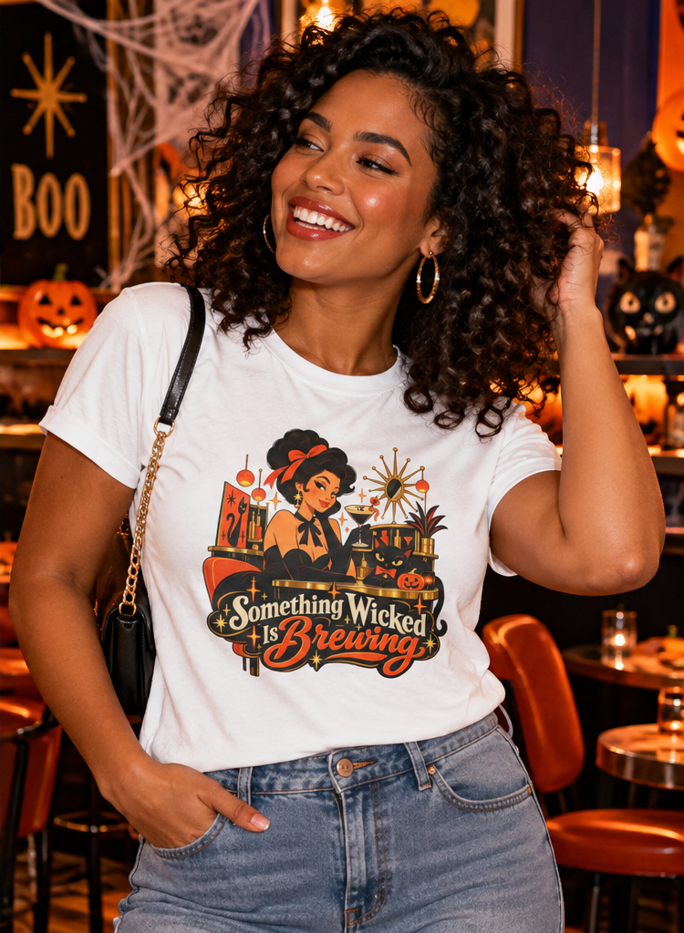Woman in white Something Wicked Is Brewing Halloween shirt at a festive cocktail bar