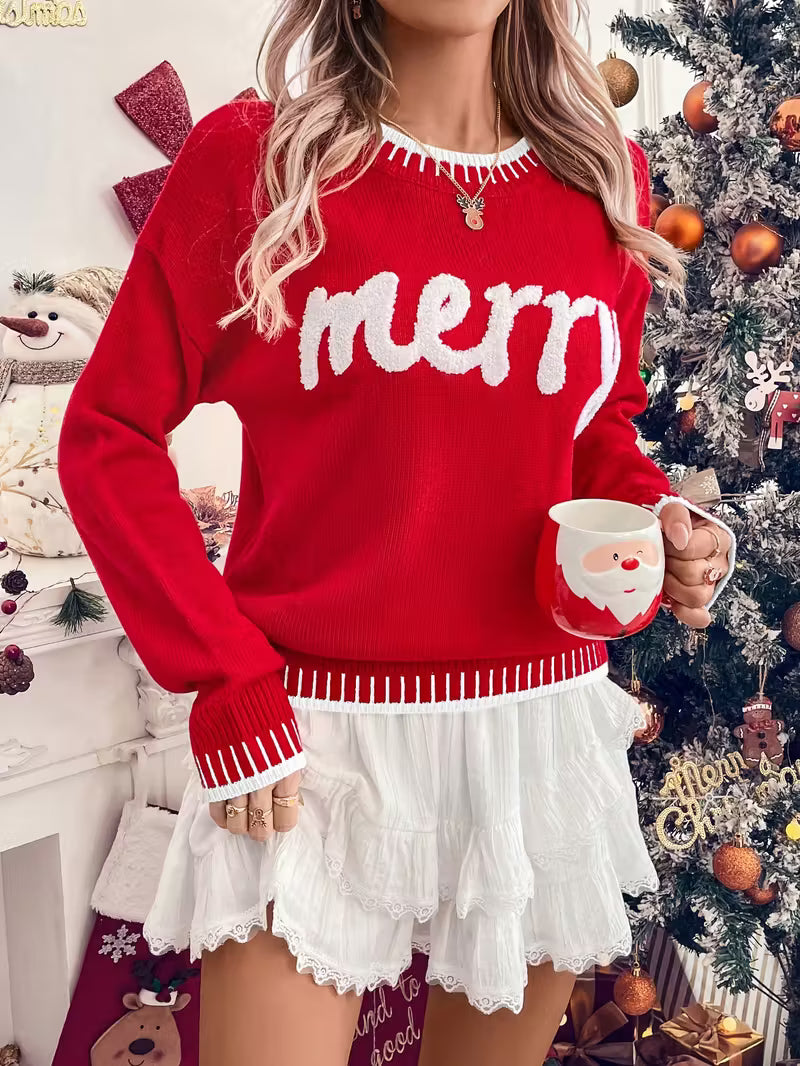Person wearing a red sweater with 'merry' text, holding a Santa mug, in a festive setting with a Christmas tree.
