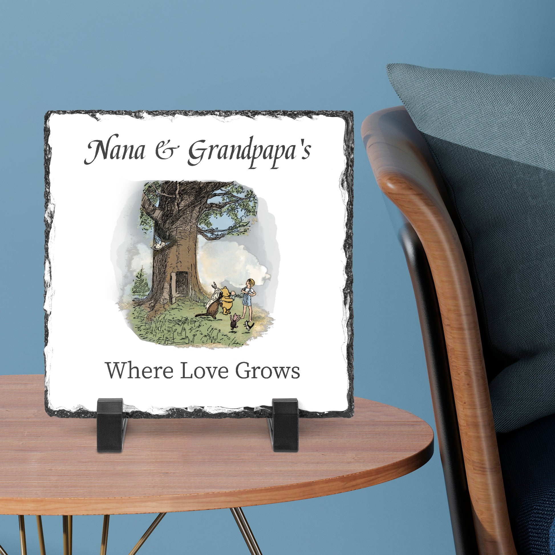 Nana & Granpapa's Where Love Grows Classic Pooh Slate Sign  on a side table.