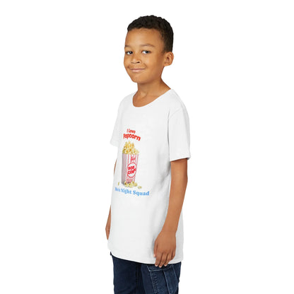 Smiling boy wearing white t-shirt with popcorn graphic and text 'I love popcorn' and 'Movie Night Squad'