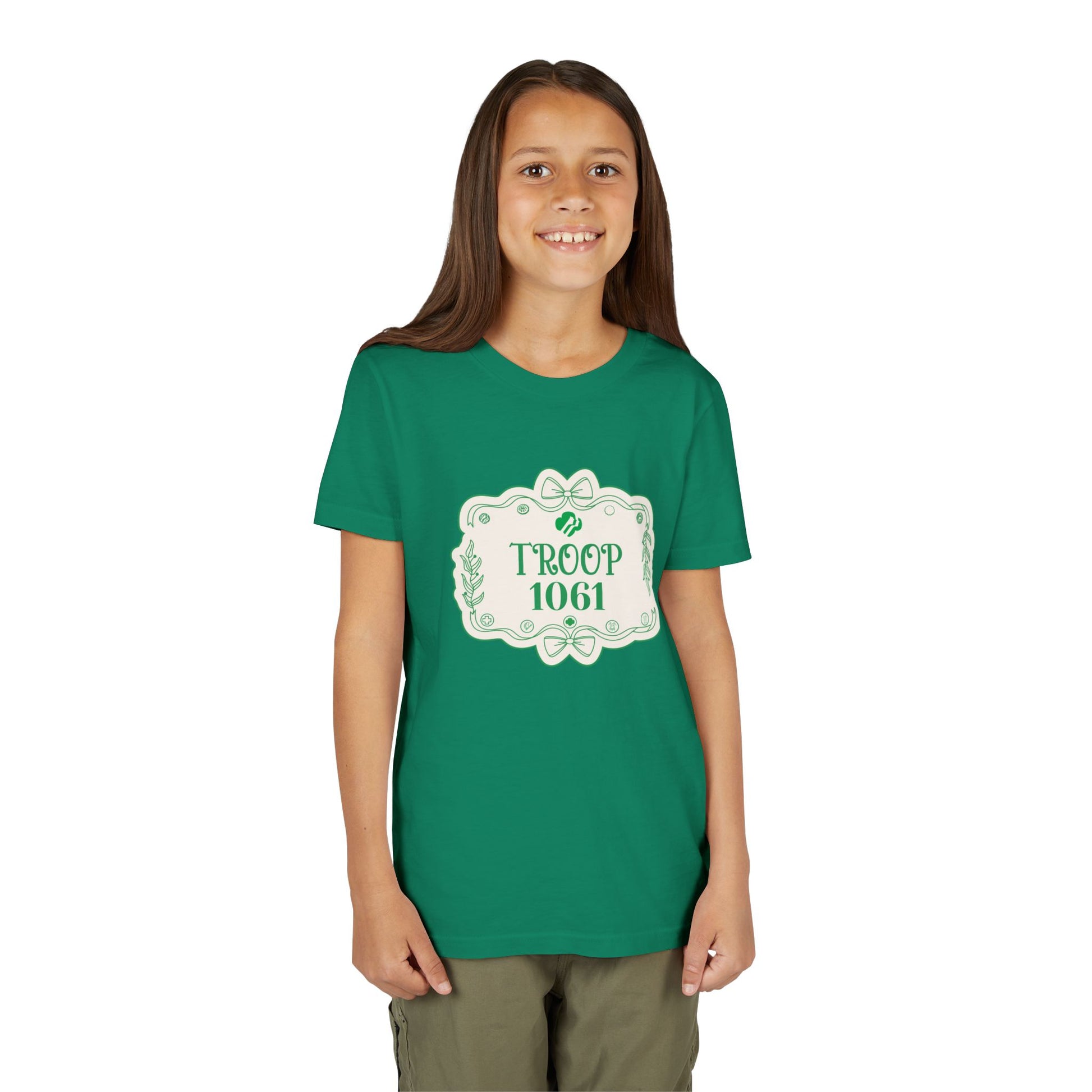 Girl wearing a green t-shirt with 'Troop 1061' design on a white background
