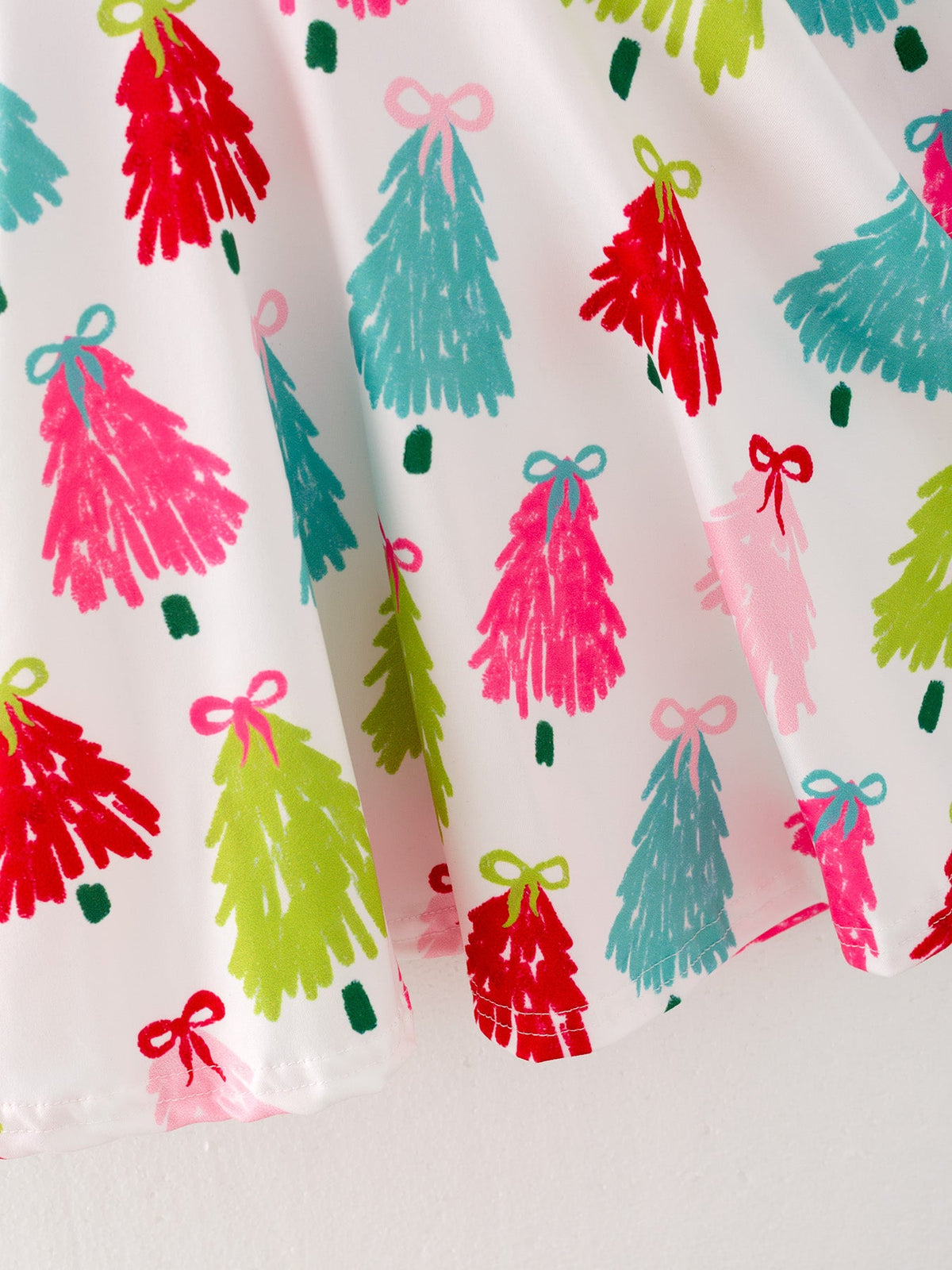 Girls Christmas Dress | Colorful Tree Print: Skirt and hem detail