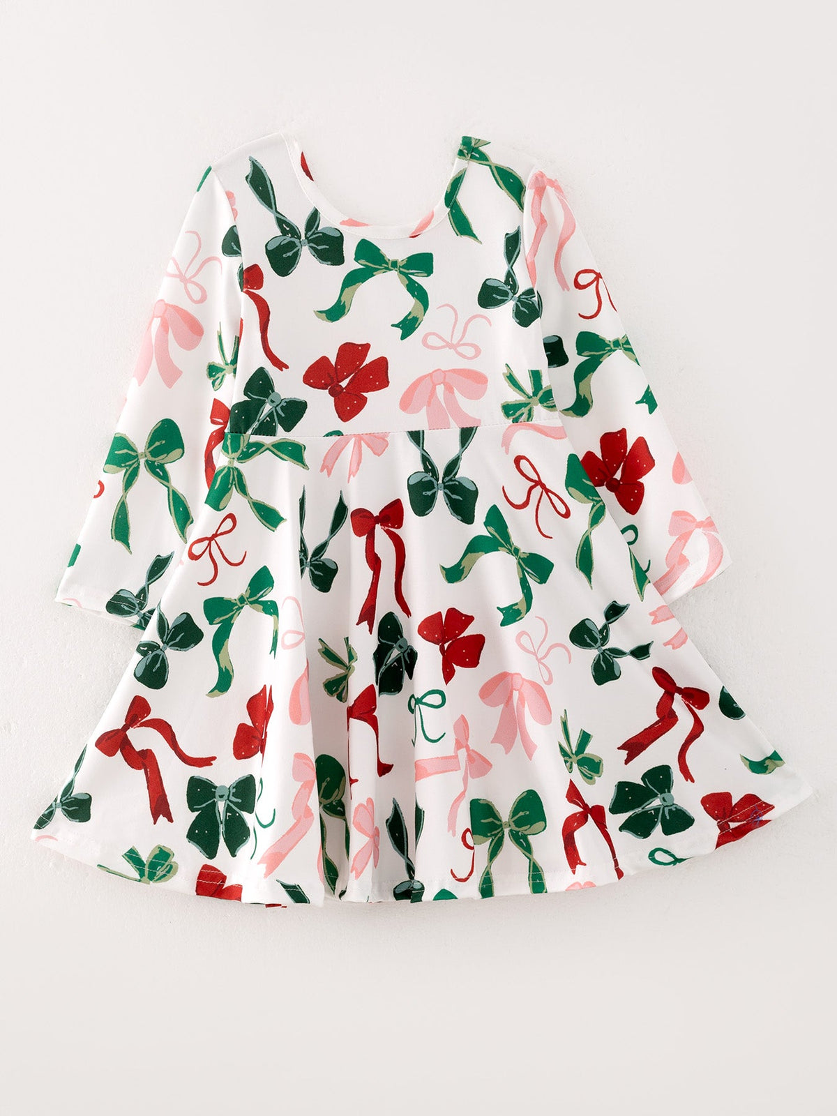 Girls festive Christmas bow print dress, featured product photograph