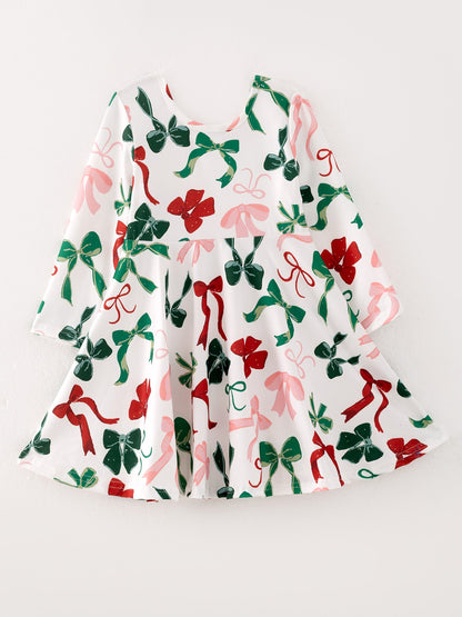 Girls festive Christmas bow print dress, featured product photograph