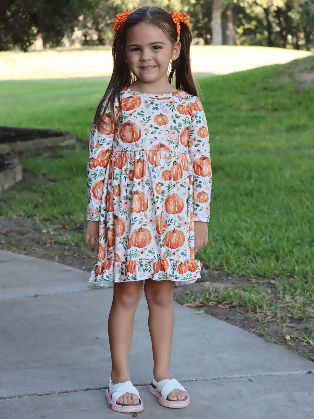 Girls Fall Dress | Orange Pumpkin Floral: Model wearing orange pumpkin floral dress