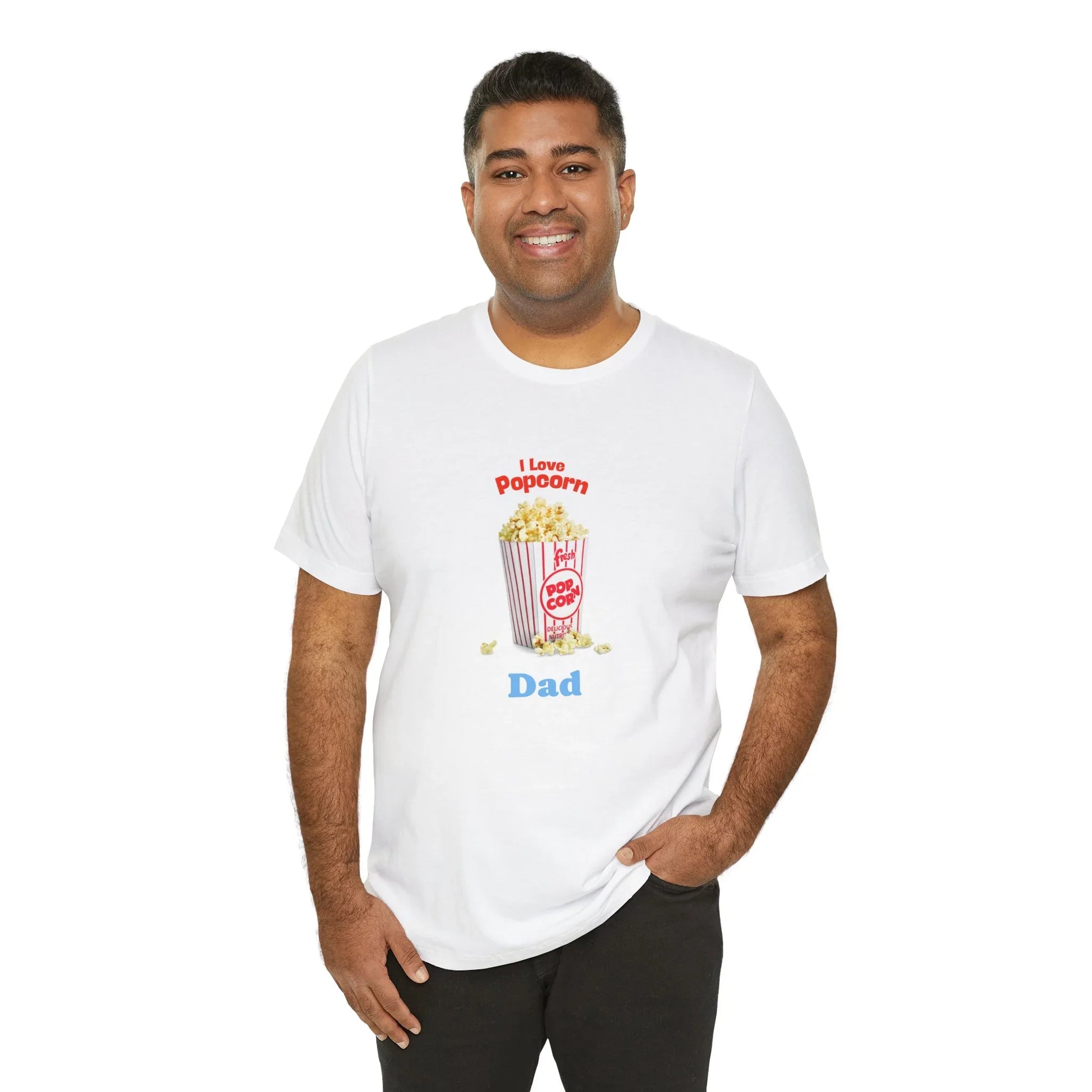 Smiling man wearing white t-shirt with I Love Popcorn Dad graphic and popcorn illustration