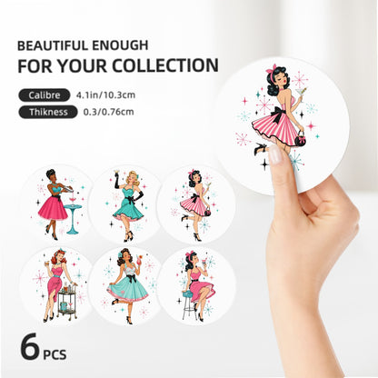 Six round sticker decals featuring retro pin-up women in pink, teal, and black dresses, shown on a white background with a hand holding one sticker. Text specifies size 4.