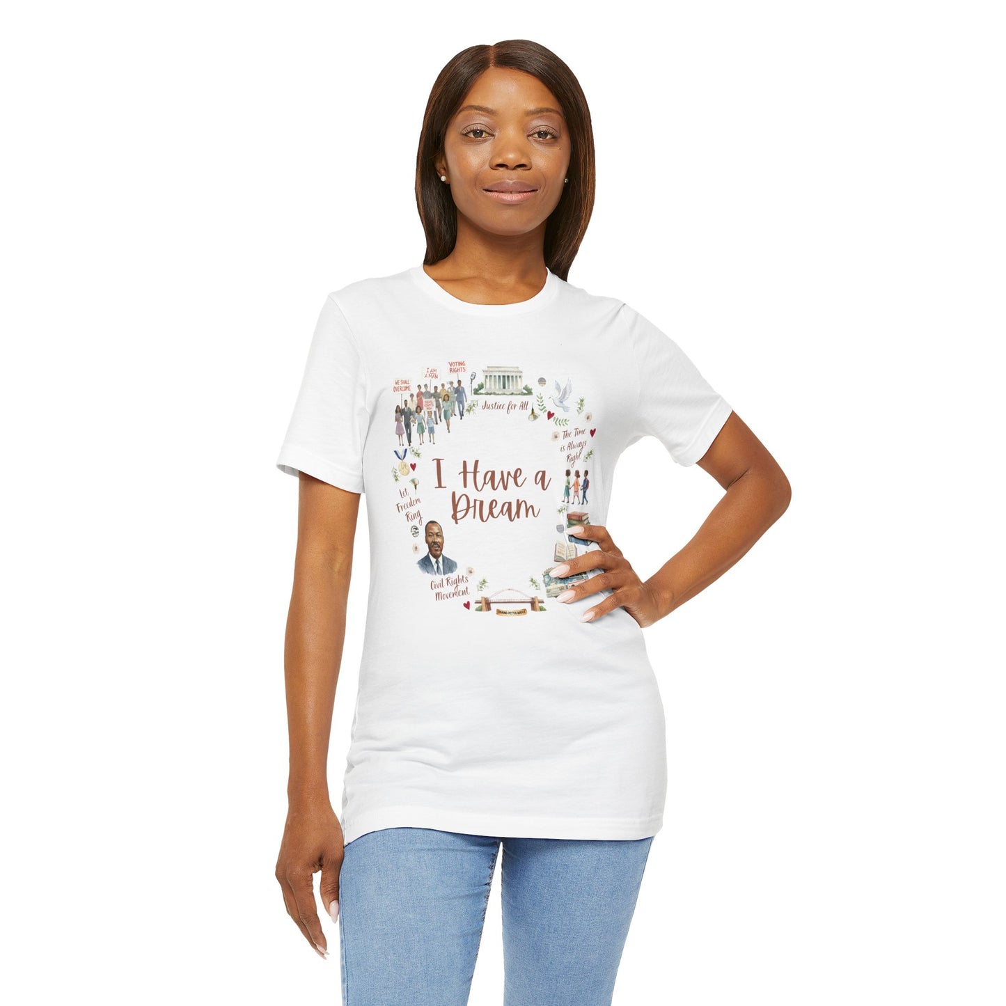 Woman wearing a white t-shirt with a MLK I have  a dream graphic design and text, standing against a white background