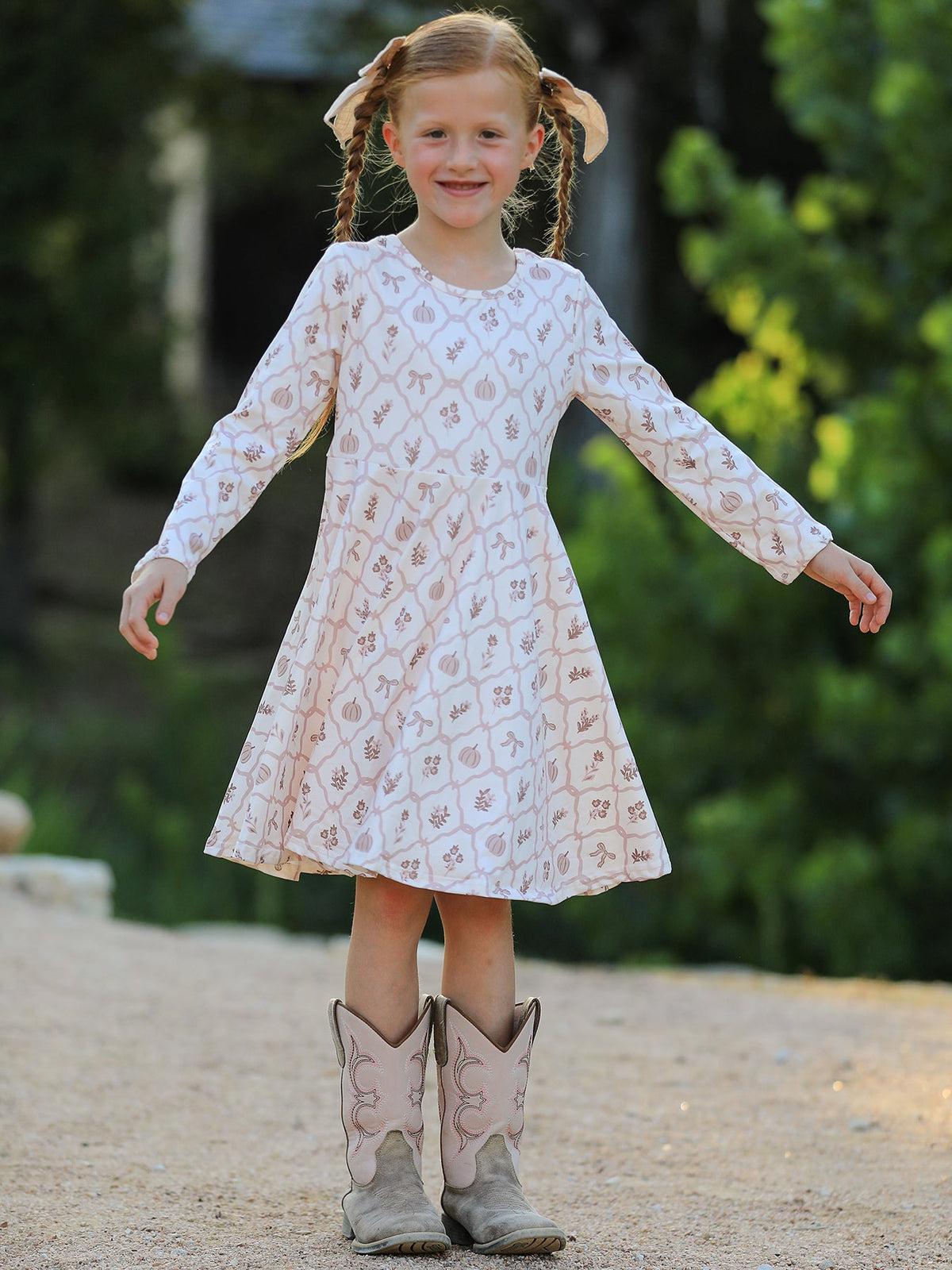 Girls Fall Dress | Pumpkin Bow Twirl: Model showing flowing skirt
